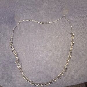 Silver tone long Necklace with bangles.